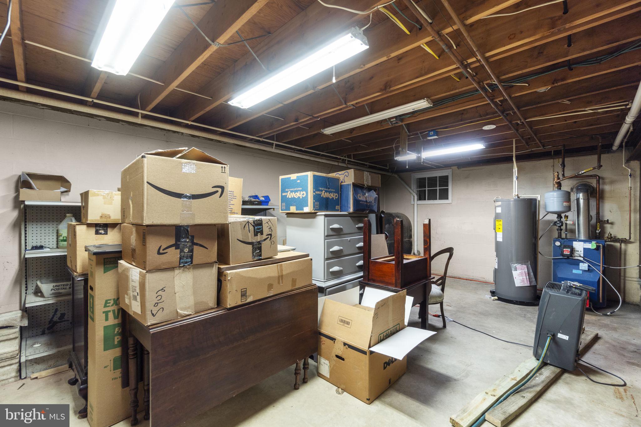 2401 Albert Rill Road Hampstead, MD 21074 - Photo 29 of 38 a living room with lots of furniture and a refrigerator