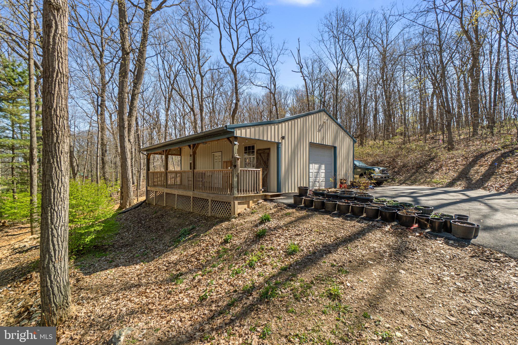 2401 Albert Rill Road Hampstead, MD 21074 - Photo 30 of 38 a backyard of a house with yard and outdoor seating