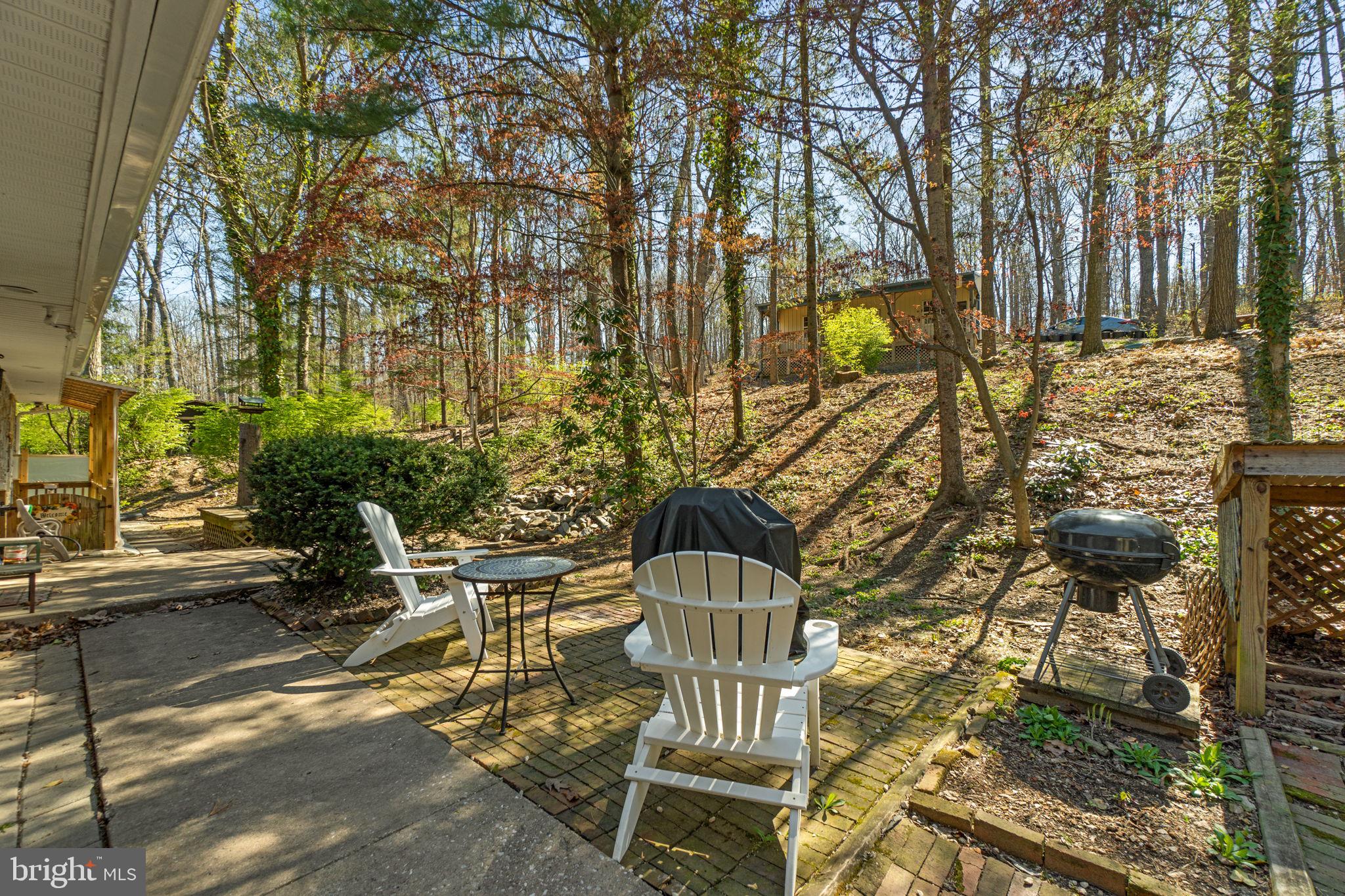 2401 Albert Rill Road Hampstead, MD 21074 - Photo 33 of 38 a view of a chairs and table in backyard