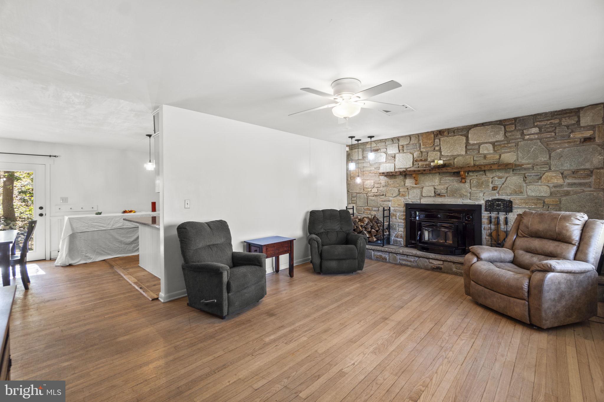 2401 Albert Rill Road Hampstead, MD 21074 - Photo 4 of 38 a living room with furniture and a fireplace