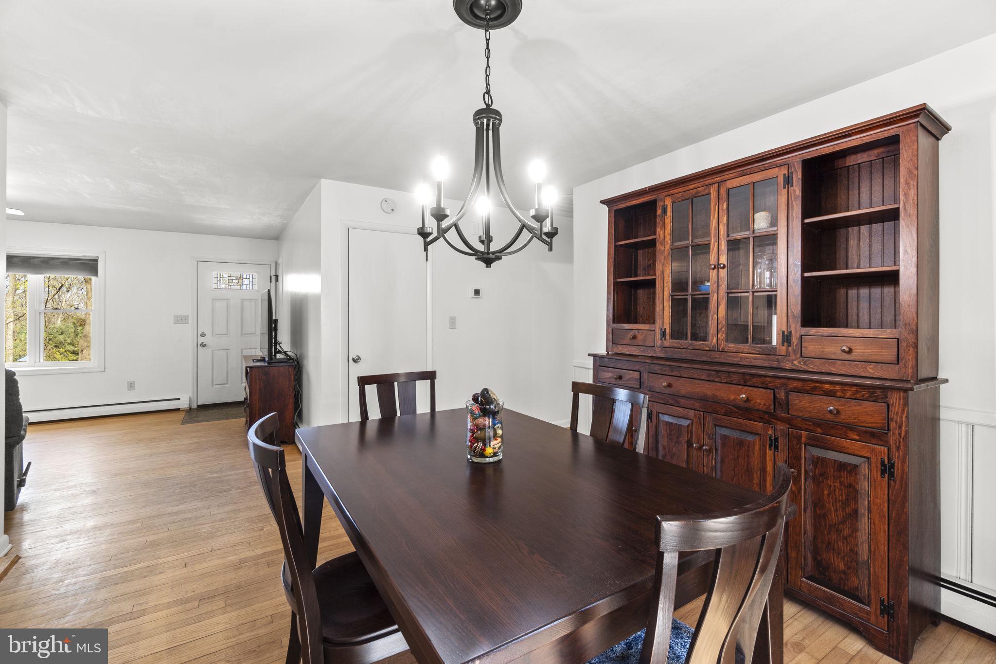 2401 Albert Rill Road Hampstead, MD 21074 - Photo 9 of 38 a view of a dining room with furniture and chandelier