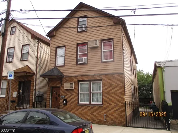 a front view of a house with parking
