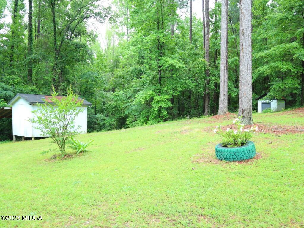 2560 Bonner Gilbert Road Lizella, GA 31052 - Photo 23 of 23 a house view with a garden space