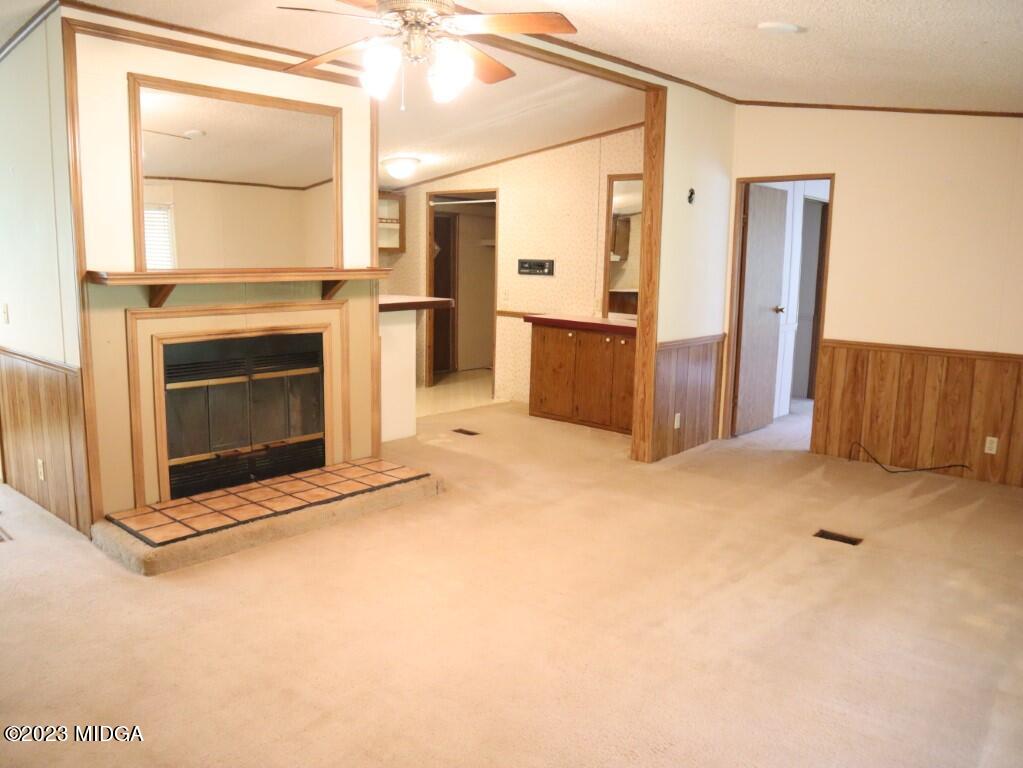 2560 Bonner Gilbert Road Lizella, GA 31052 - Photo 4 of 23 a view of a kitchen with furniture and a fireplace