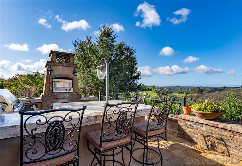 18668 Via Catania Rancho Santa Fe, CA 92091 - Photo 12 of 25 a view of a chairs and table in the patio