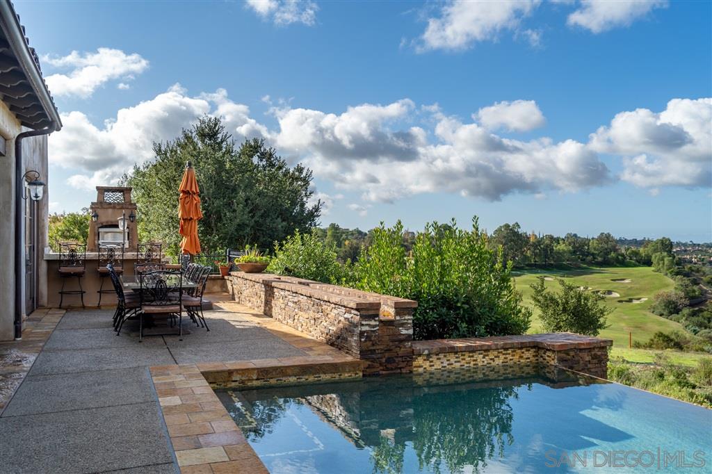 18668 Via Catania Rancho Santa Fe, CA 92091 - Photo 14 of 25 a view of a lake with lawn chairs