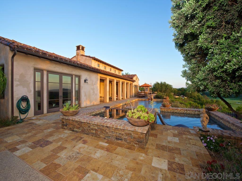 18668 Via Catania Rancho Santa Fe, CA 92091 - Photo 15 of 25 a view of a house with patio