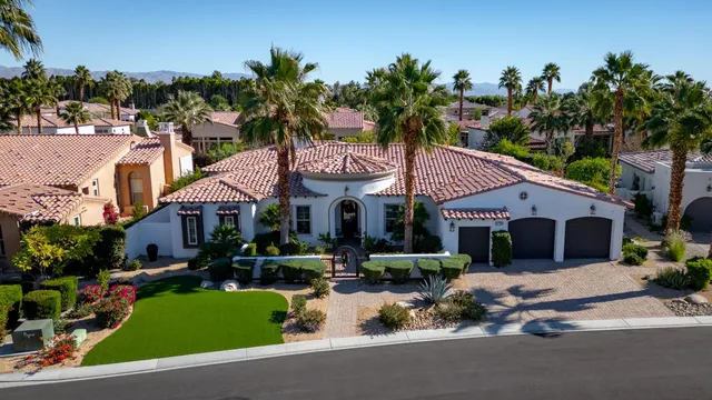 an aerial view of a house with balcony and outdoor space