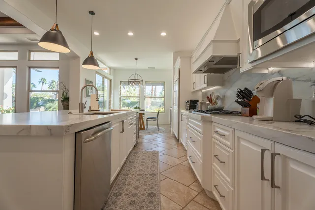 a view of walk in closet with clothes