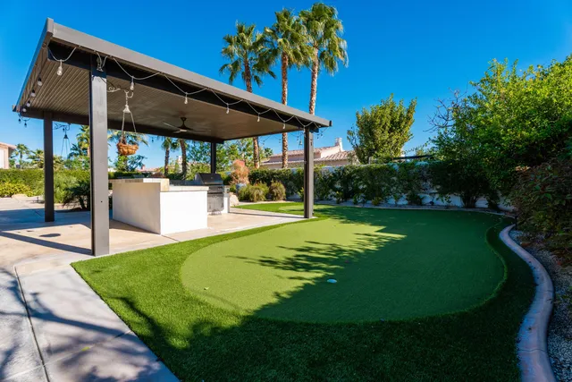 a view of a swimming pool with a patio