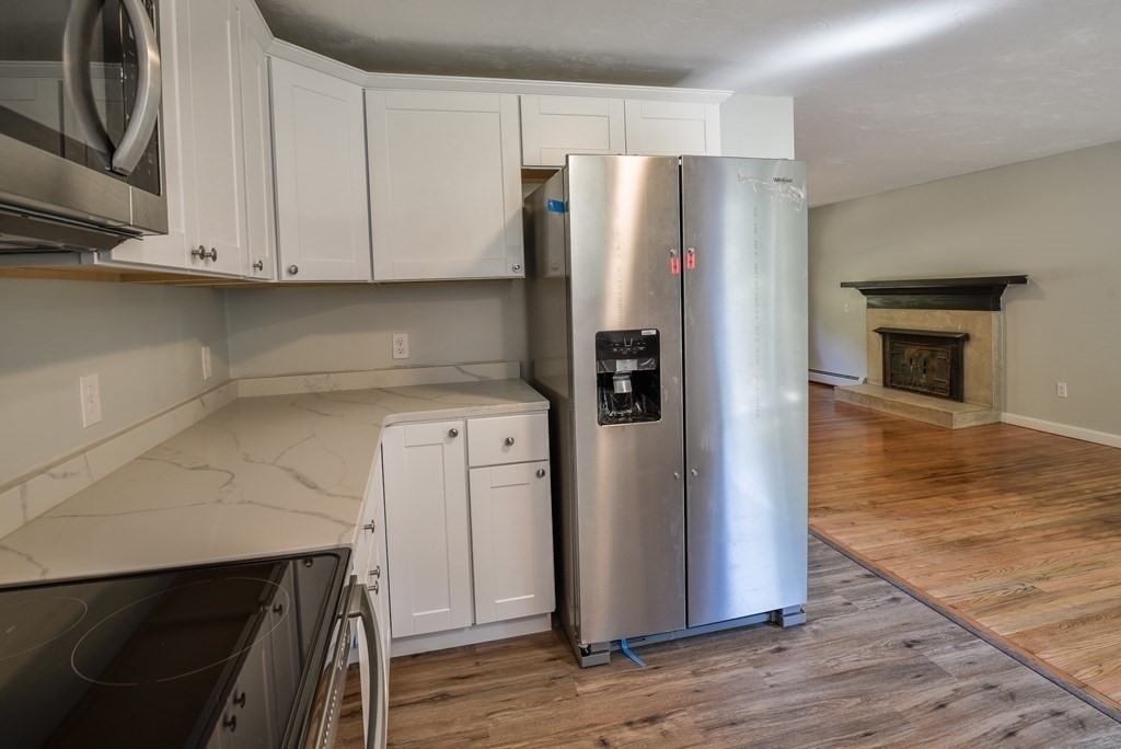 1 Ladd Road Sturbridge, MA 01566 - Photo 17 of 39 a kitchen with stainless steel appliances a refrigerator and a stove top oven