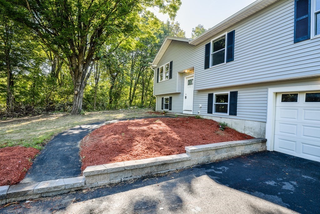 1 Ladd Road Sturbridge, MA 01566 - Photo 3 of 39 a view of a house with backyard and sitting area