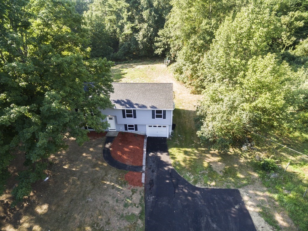 1 Ladd Road Sturbridge, MA 01566 - Photo 7 of 39 a view of a back yard of the house