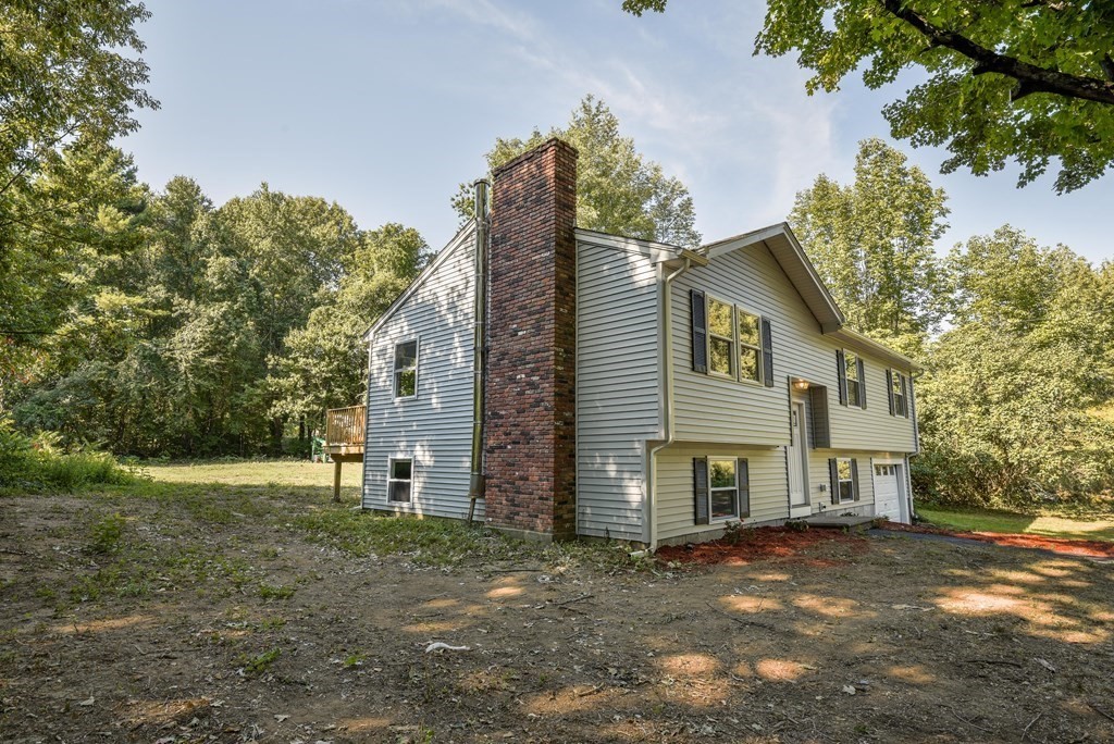 1 Ladd Road Sturbridge, MA 01566 - Photo 8 of 39 a view of a house with a yard