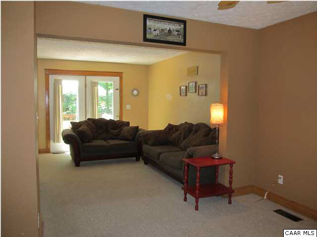 10 Colonial Road Palmyra, VA 22963 - Photo 27 of 27 a living room with a couch and a window