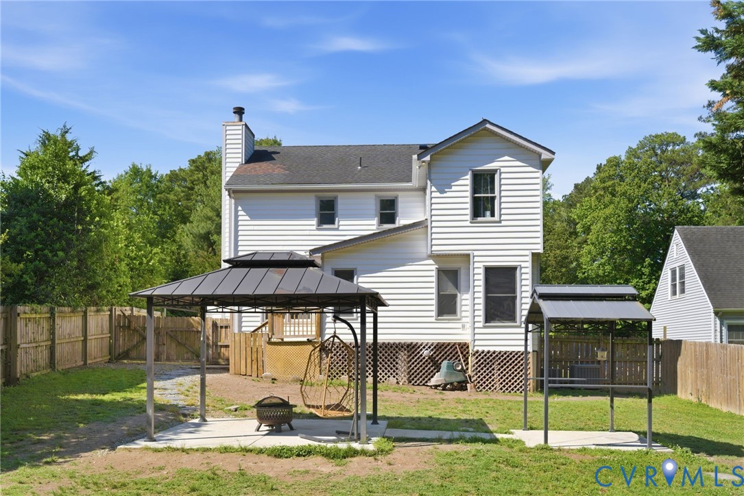 9110 Gayton Road Henrico, VA 23229 - Photo 40 of 54 a view of a house with backyard porch and sitting area