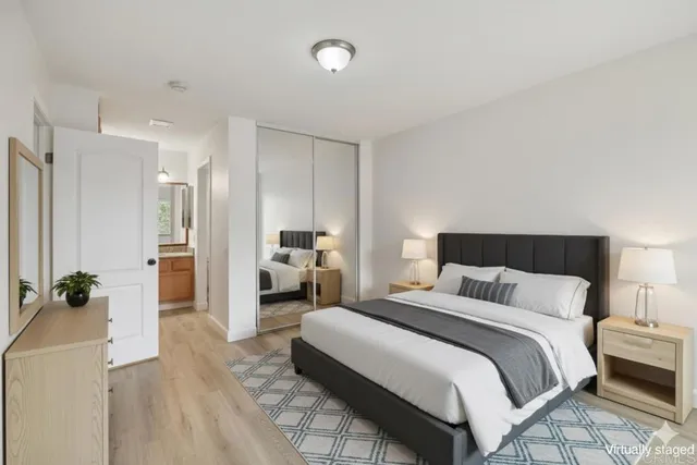 a bedroom with a bed and a couch