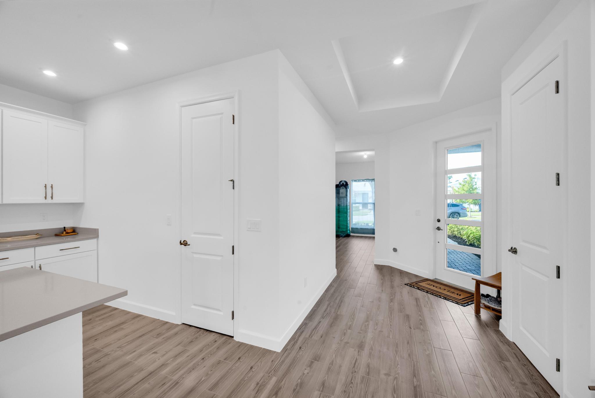 9060 Remy Lane Port St. Lucie, FL 34987 - Photo 11 of 33 a view of an empty room and a kitchen