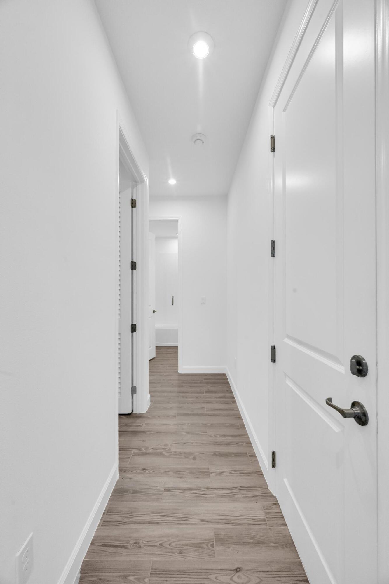 9060 Remy Lane Port St. Lucie, FL 34987 - Photo 14 of 33 a view of a bathroom with wooden floor