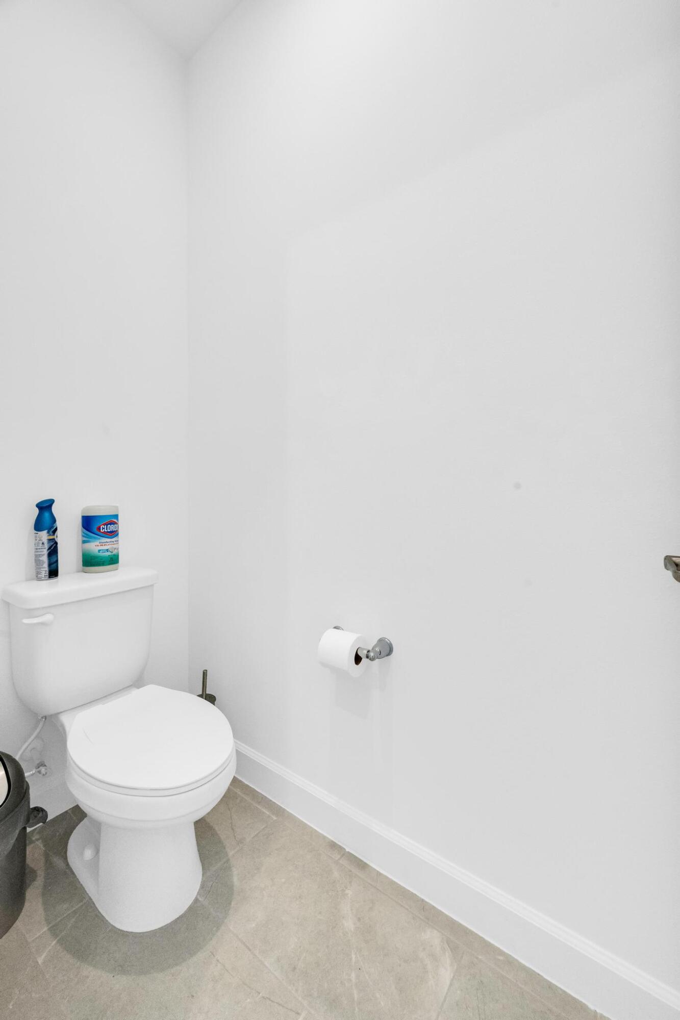 9060 Remy Lane Port St. Lucie, FL 34987 - Photo 23 of 33 a white toilet sitting next to a white wall