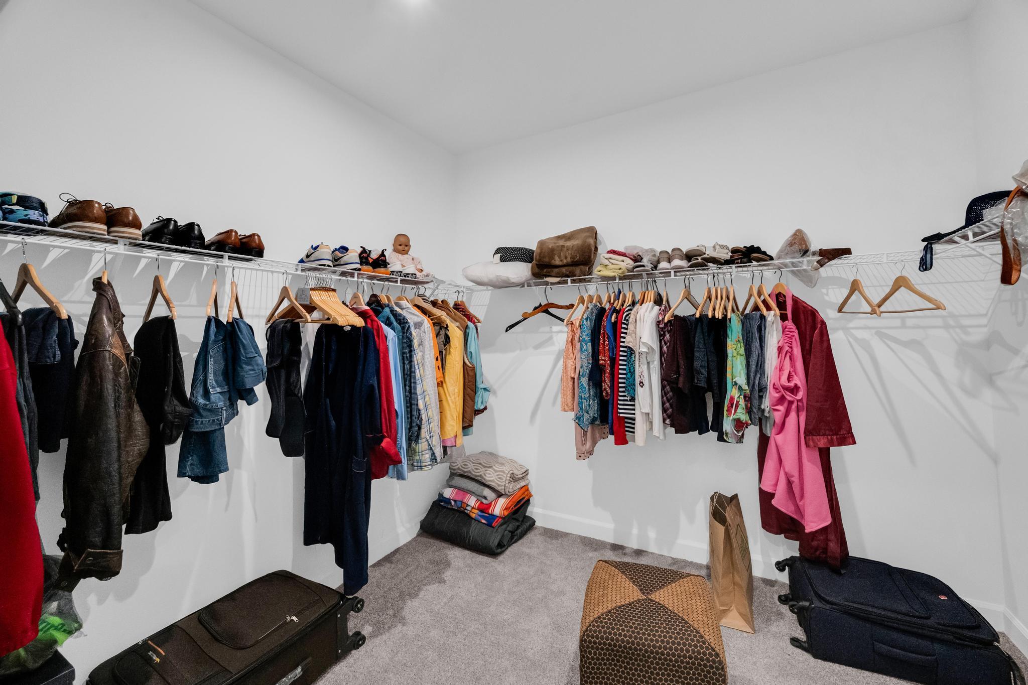 9060 Remy Lane Port St. Lucie, FL 34987 - Photo 27 of 33 a view of walk in closet with clothes and shoes
