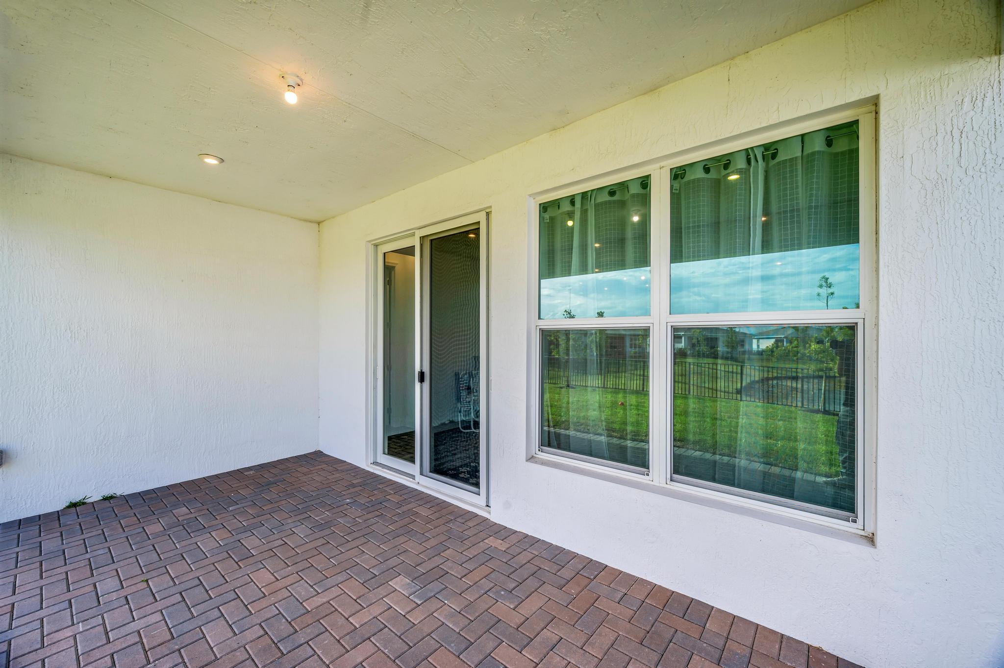 9060 Remy Lane Port St. Lucie, FL 34987 - Photo 32 of 33 a view of room with window and front door