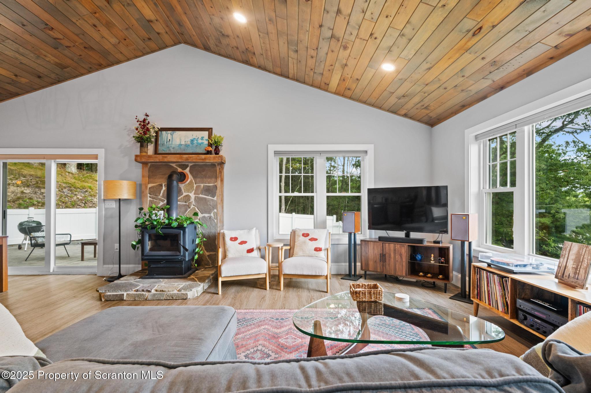 300 Gumbletown Road Paupack, PA 18451 - Photo 13 of 46 a living room with furniture and a flat screen tv