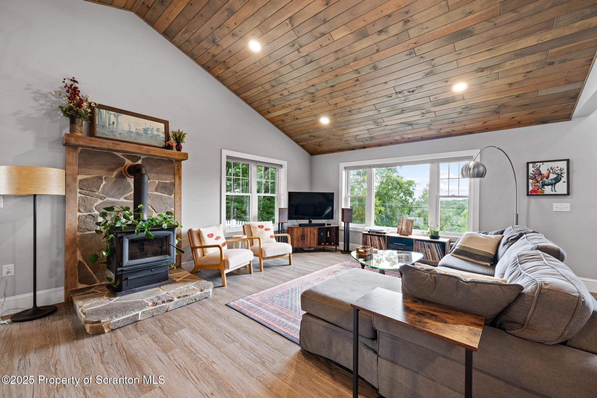 300 Gumbletown Road Paupack, PA 18451 - Photo 15 of 46 a living room with furniture and a large window