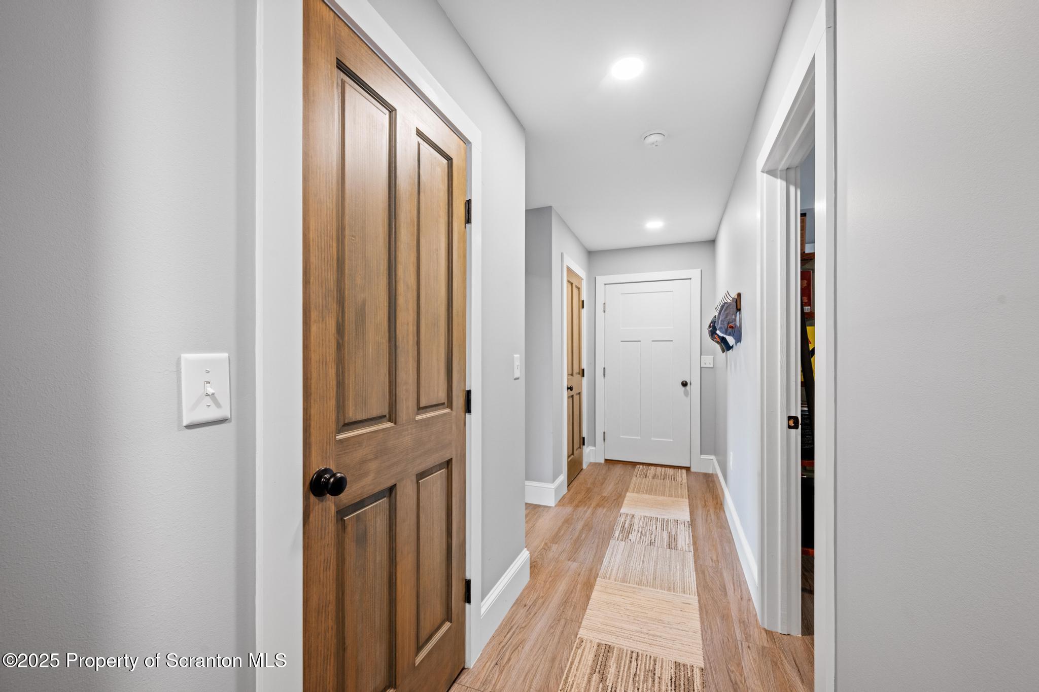 300 Gumbletown Road Paupack, PA 18451 - Photo 16 of 46 a view of a hallway with wooden floor and staircase