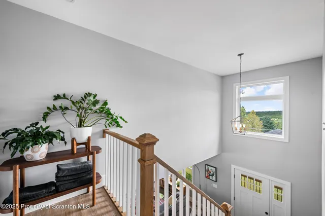 a view of entryway with wooden floor