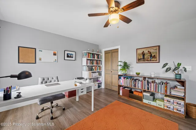 a workspace with furniture and book shelf
