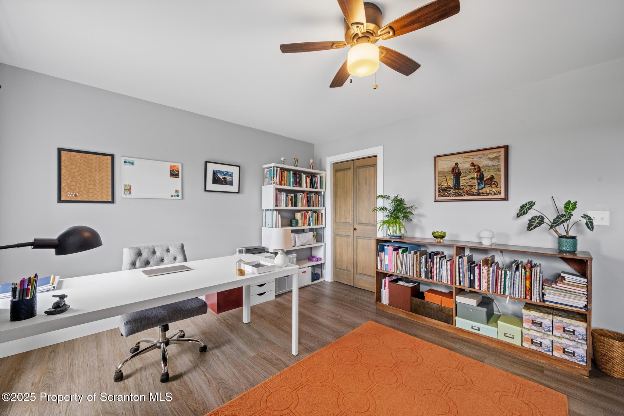 300 Gumbletown Road Paupack, PA 18451 - Photo 27 of 46 a workspace with furniture and book shelf
