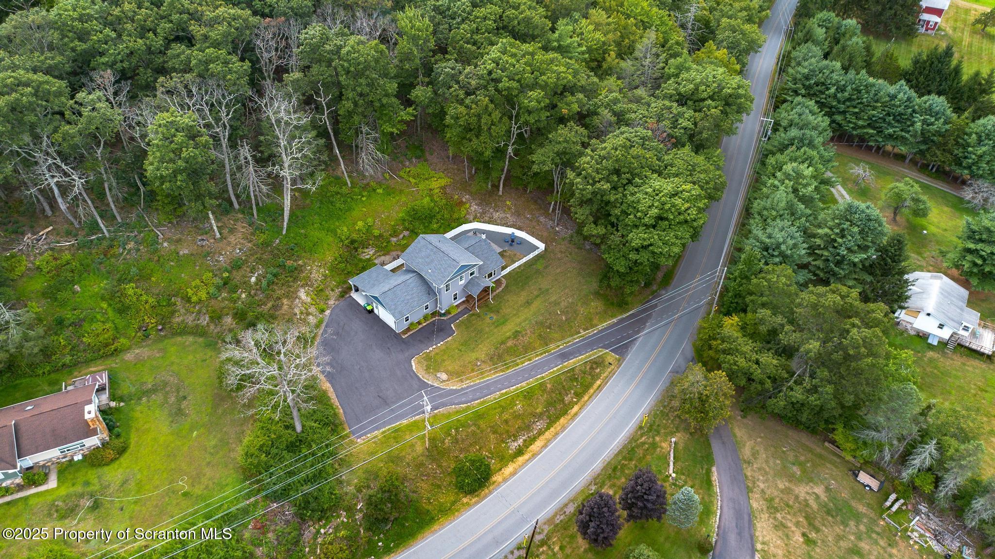 300 Gumbletown Road Paupack, PA 18451 - Photo 33 of 46 an aerial view of a house with a yard