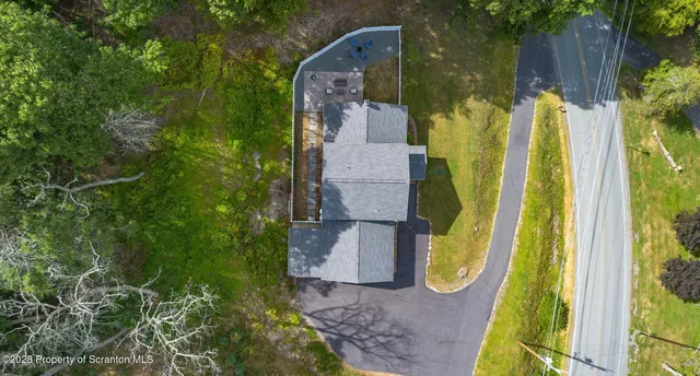 a aerial view of a house with a garden