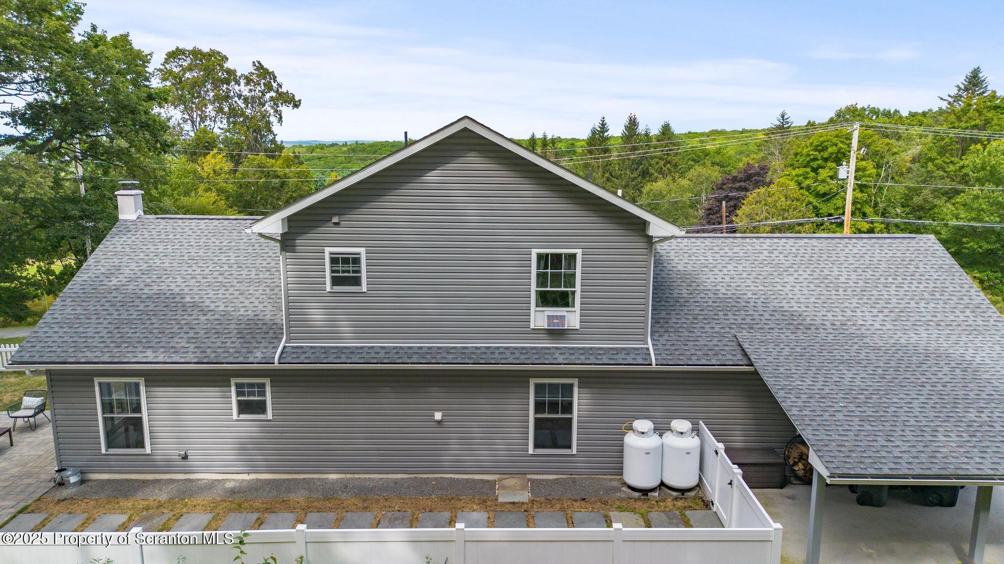 300 Gumbletown Road Paupack, PA 18451 - Photo 41 of 46 a front view of a house with a garden