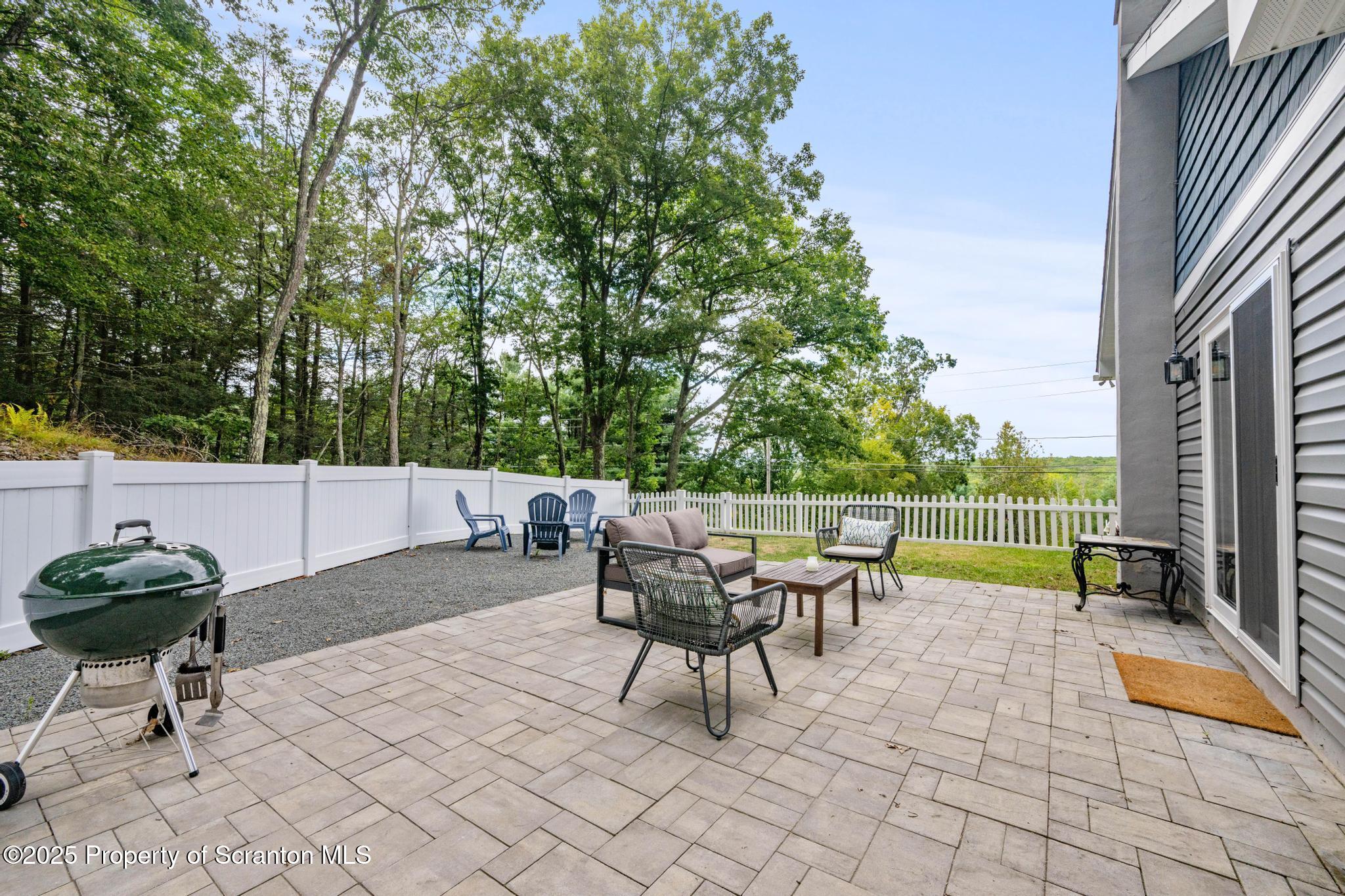 300 Gumbletown Road Paupack, PA 18451 - Photo 43 of 46 a roof deck with table and chairs and potted plants