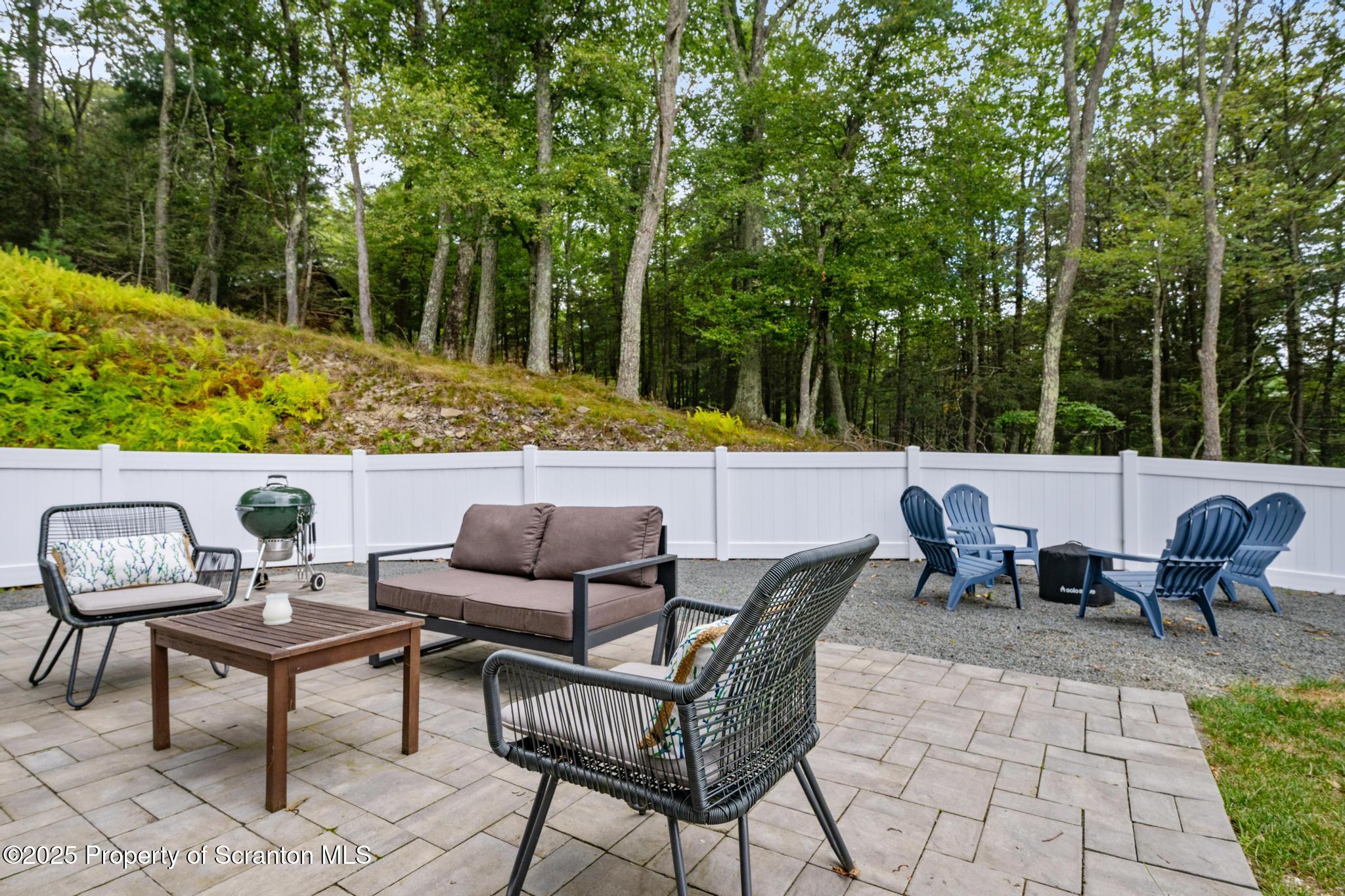 300 Gumbletown Road Paupack, PA 18451 - Photo 45 of 46 a view of an outdoor sitting area with fire pit