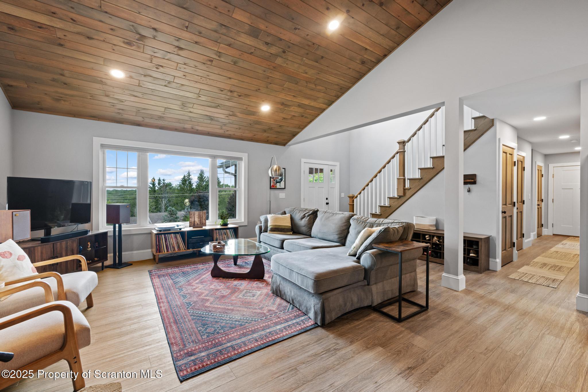 300 Gumbletown Road Paupack, PA 18451 - Photo 5 of 46 a living room with furniture and a flat screen tv