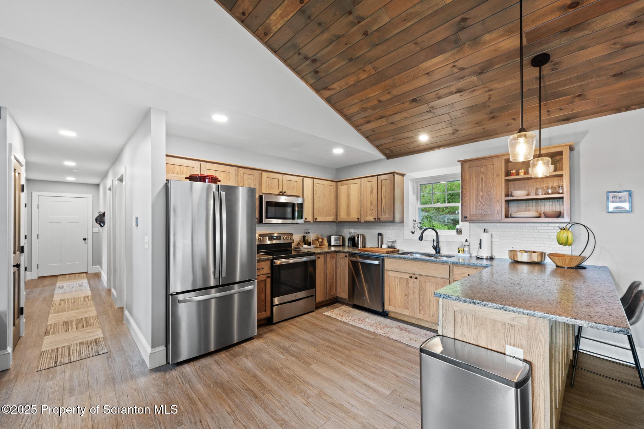 300 Gumbletown Road Paupack, PA 18451 - Photo 6 of 46 a kitchen with refrigerator and chairs