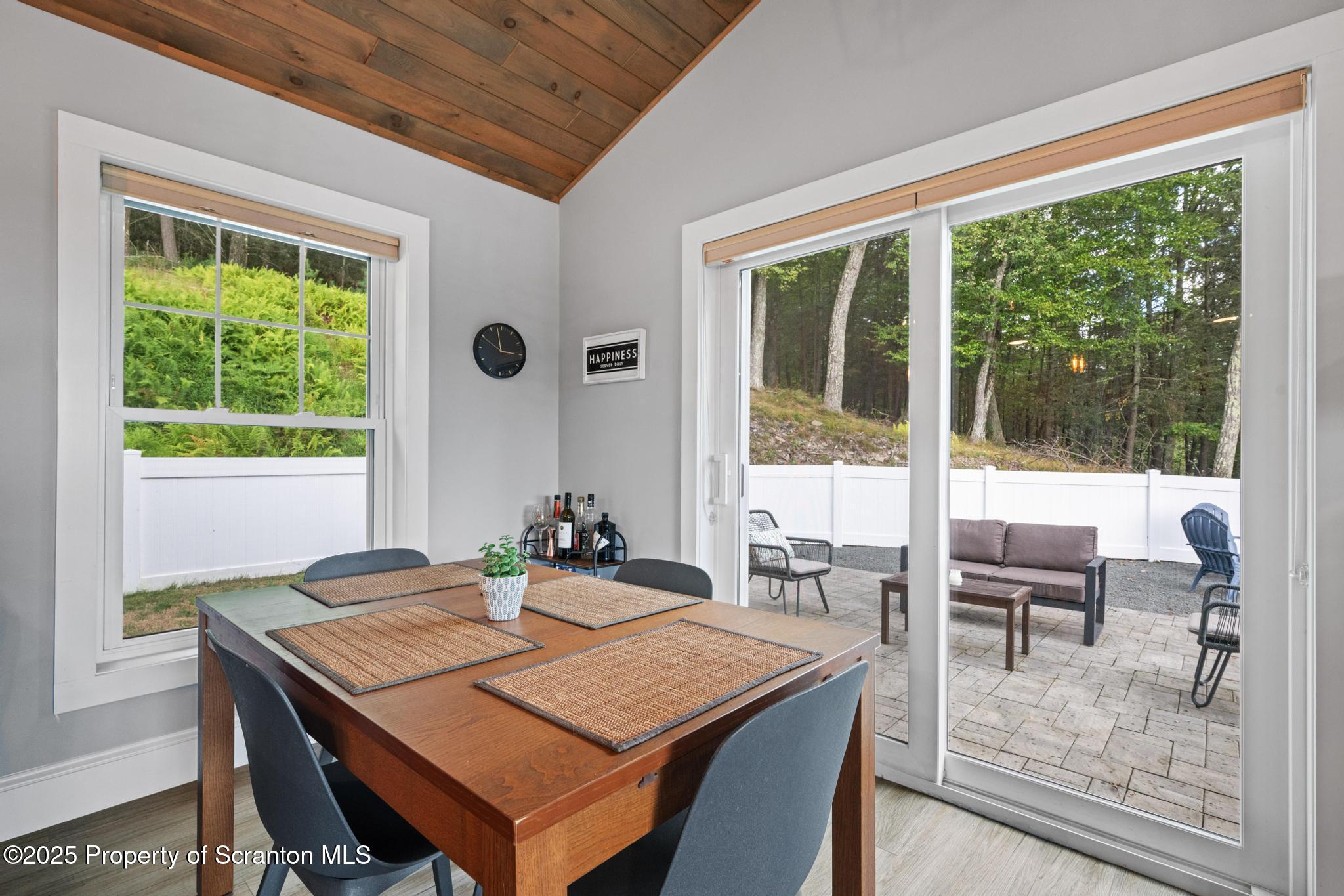 300 Gumbletown Road Paupack, PA 18451 - Photo 8 of 46 a dining room with a table and chairs