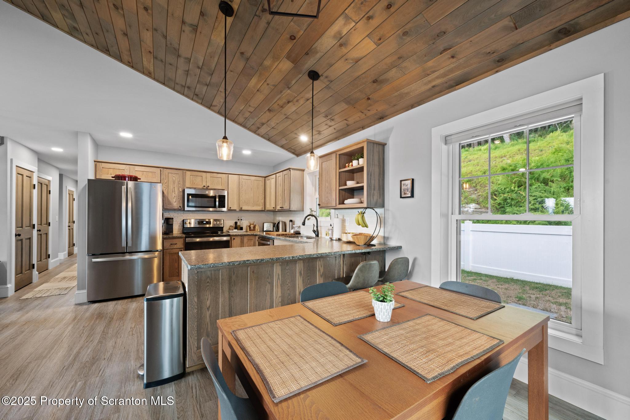 300 Gumbletown Road Paupack, PA 18451 - Photo 9 of 46 a large kitchen with a table and chairs