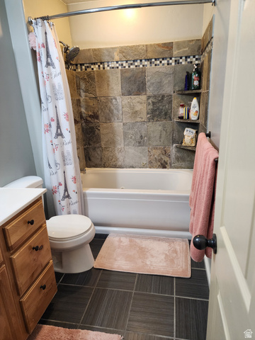 2525 West 450 South, Unit 8 Springville, UT 84663 - Photo 9 of 22 Bathtub-shower combination featuring large format stone-look tile with a mosaic accent band