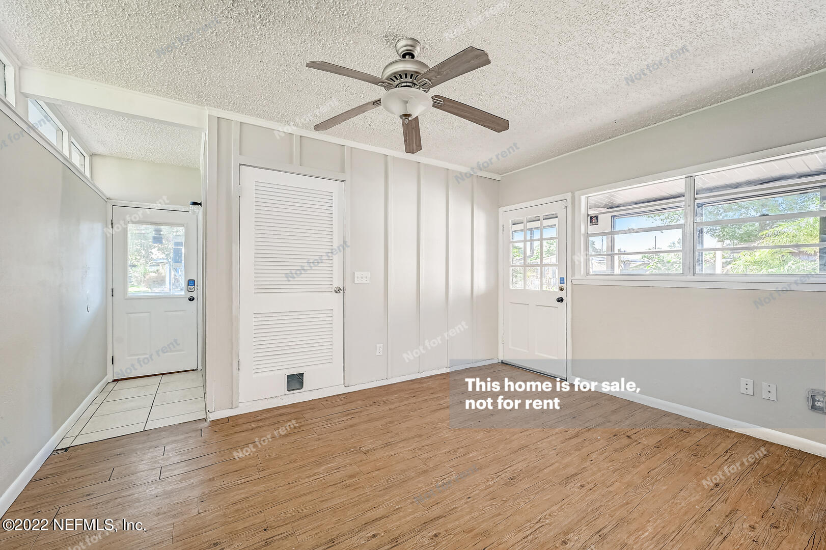 10918 Java Drive Jacksonville, FL 32246 - Photo 20 of 25 wooden floor in an empty room with a window