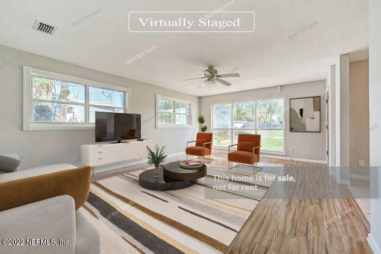 10918 Java Drive Jacksonville, FL 32246 - Photo 2 of 25 a living room with furniture and a flat screen tv