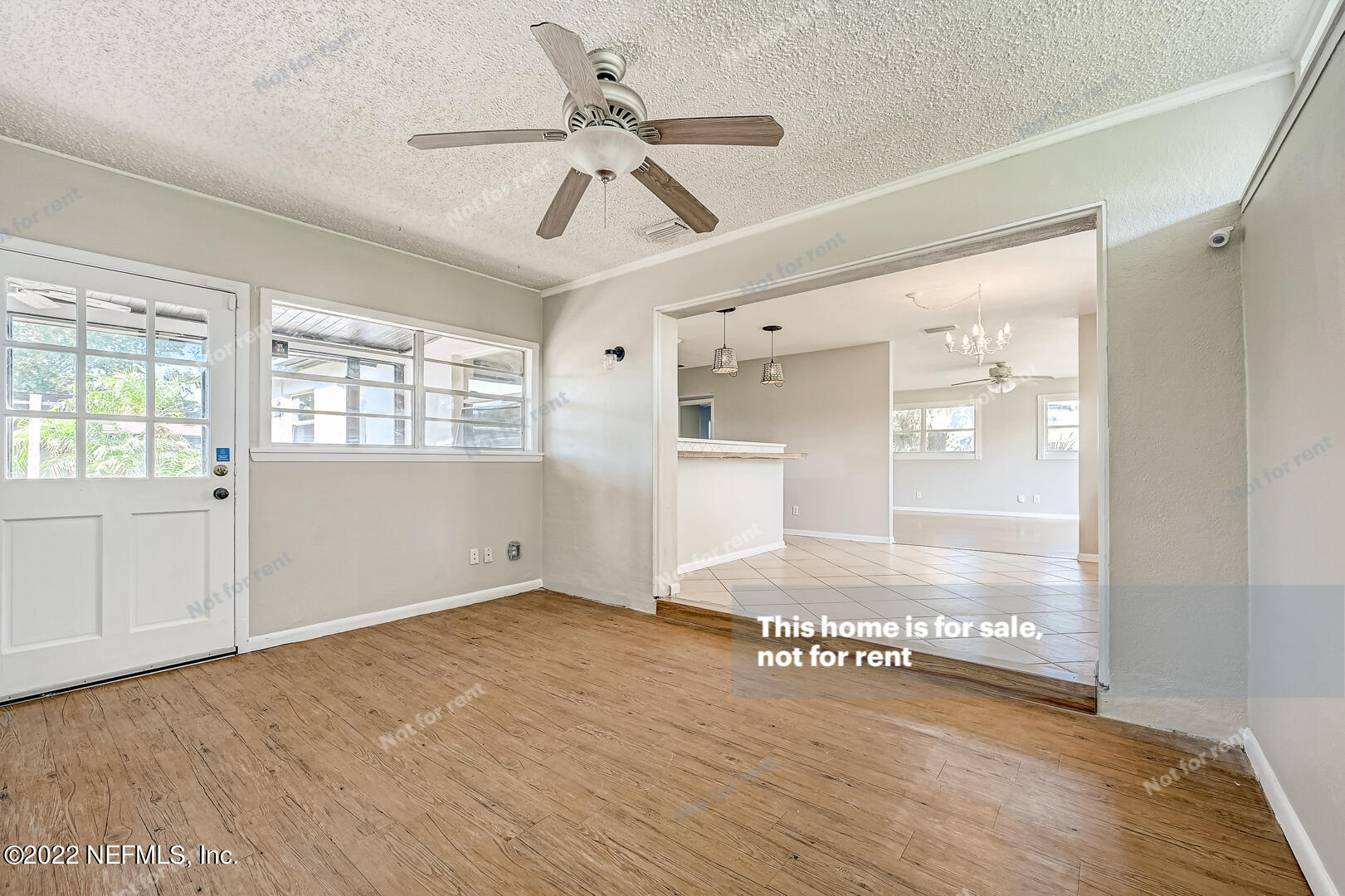 10918 Java Drive Jacksonville, FL 32246 - Photo 21 of 25 a view of an empty room with wooden floor and a window