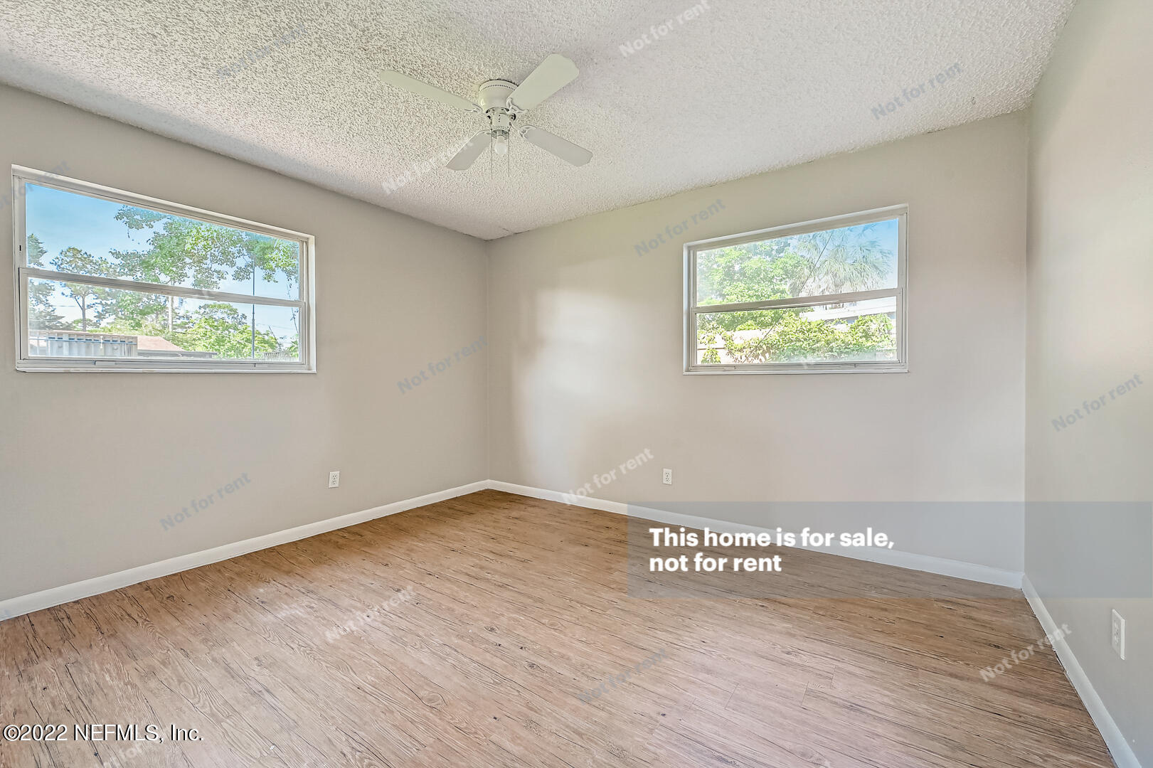 10918 Java Drive Jacksonville, FL 32246 - Photo 24 of 25 a view of an empty room with a window and wooden floor
