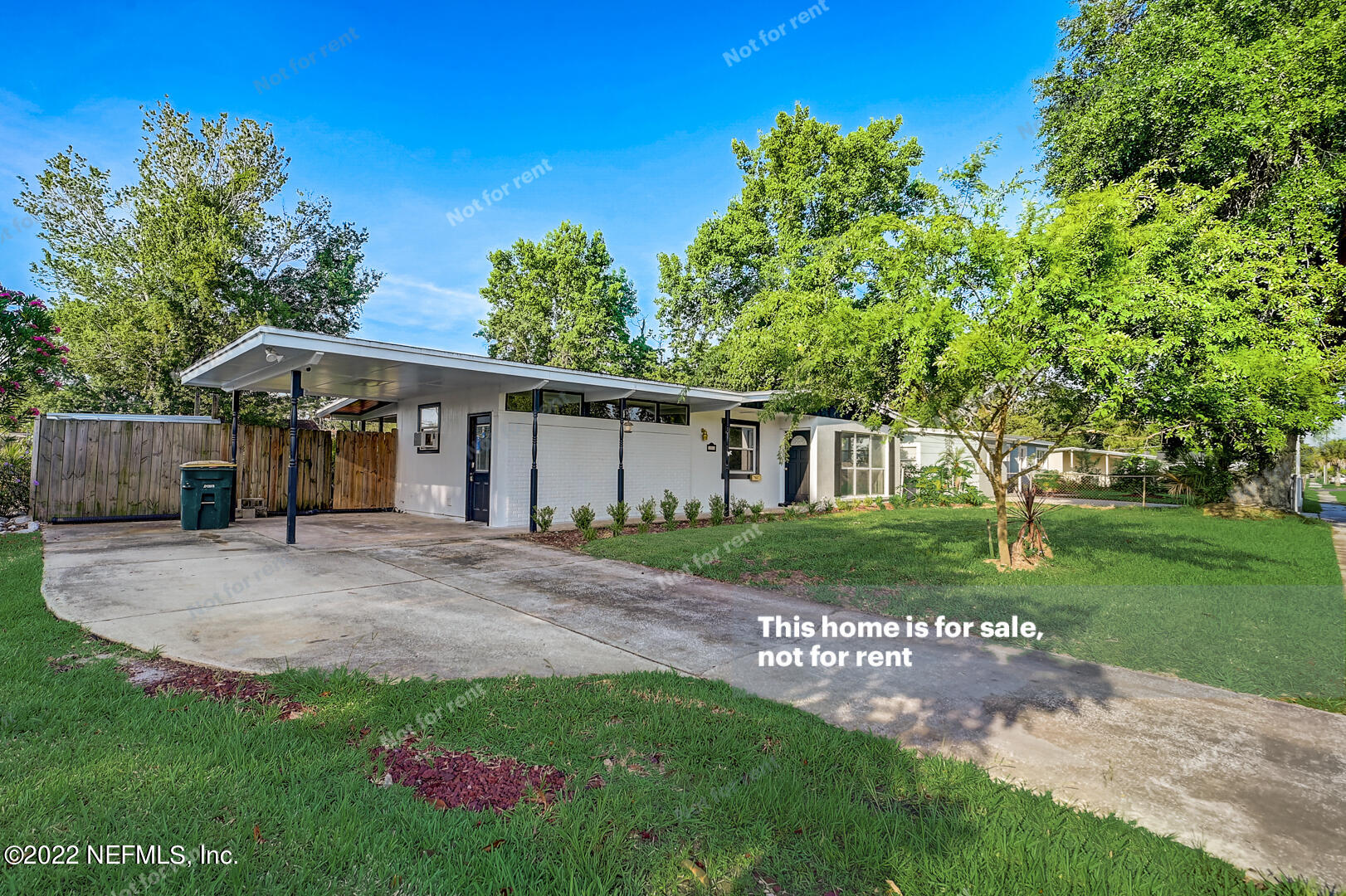 10918 Java Drive Jacksonville, FL 32246 - Photo 9 of 25 a view of a house with yard and a garden