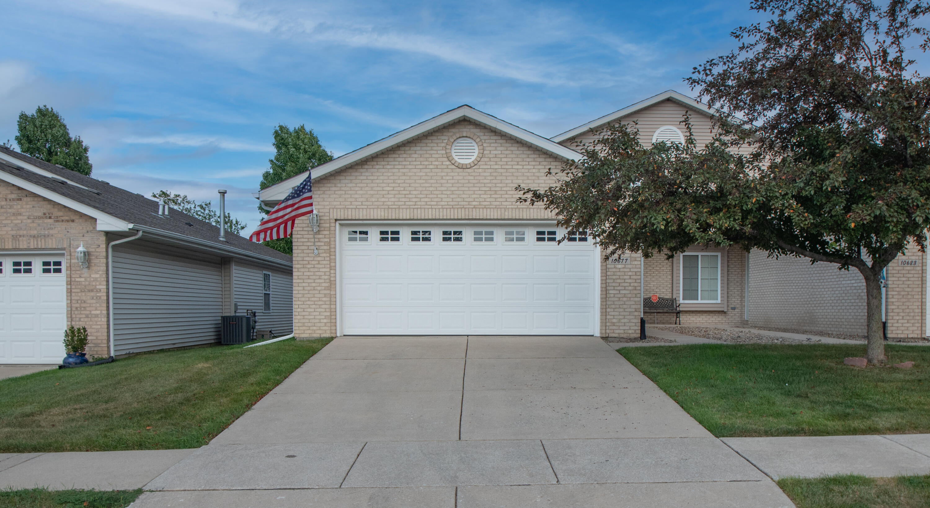 10677 Keystone Lane Crown Point, IN 46307 - Photo 1 of 33 a view of a house with a yard and garage