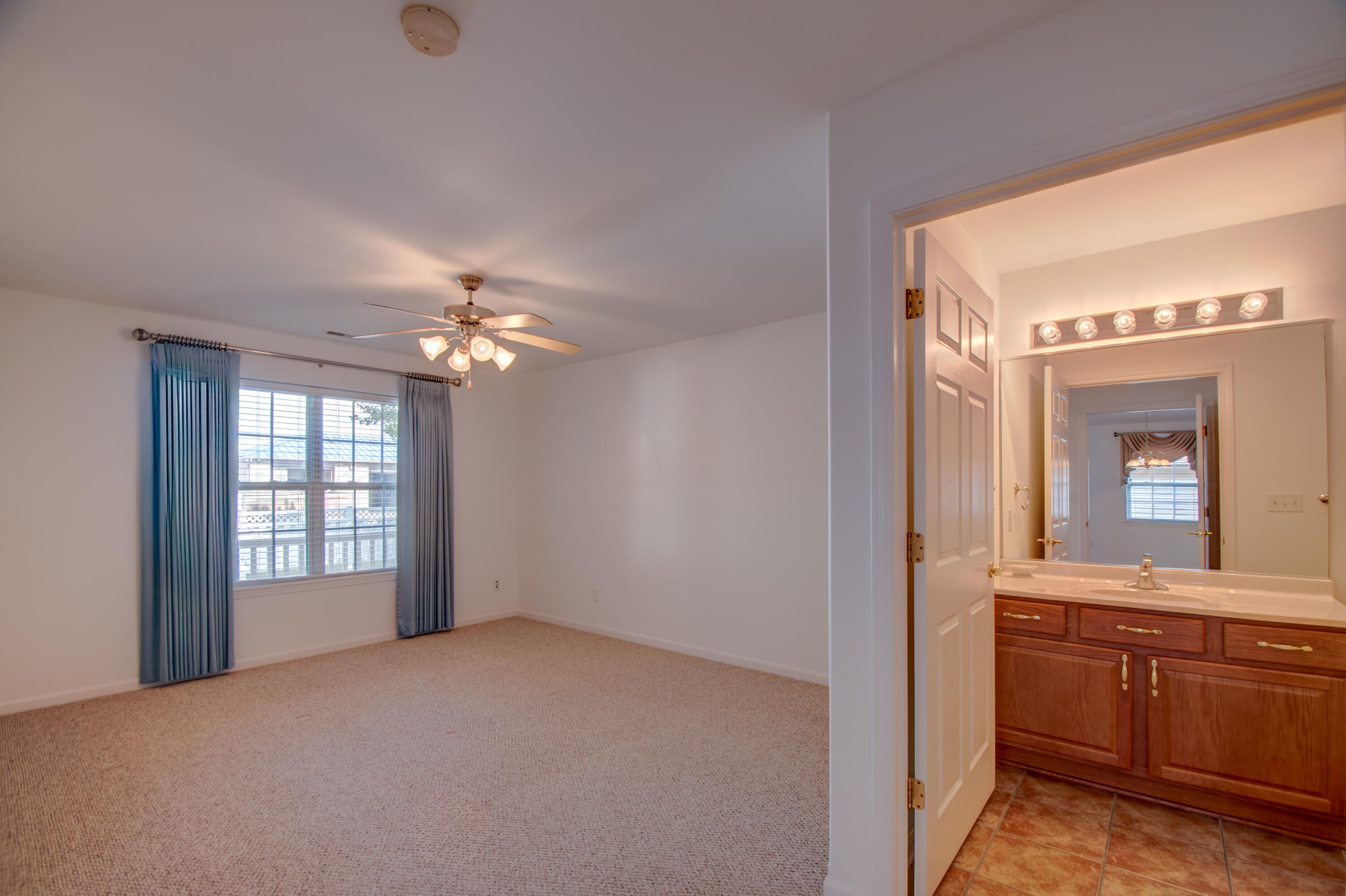 10677 Keystone Lane Crown Point, IN 46307 - Photo 14 of 33 a view of an empty room with a kitchen and a window