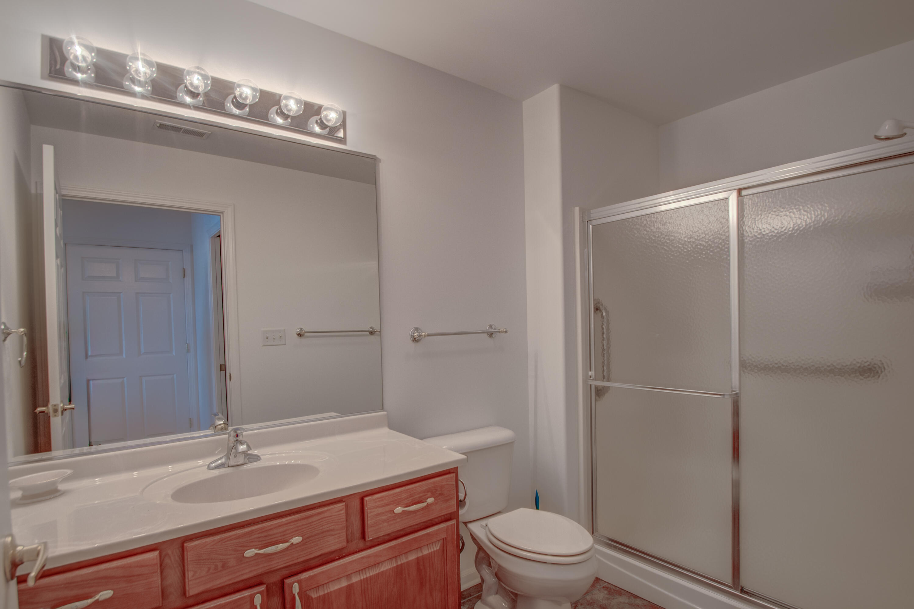 10677 Keystone Lane Crown Point, IN 46307 - Photo 15 of 33 a bathroom with a sink a toilet and shower